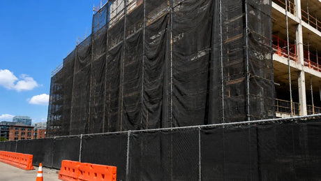 Fire retardant safety netting and debris netting installed on a construction site